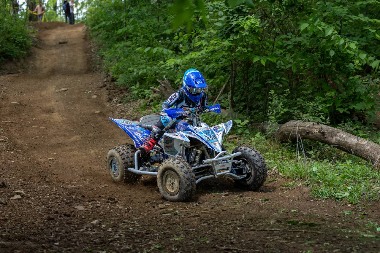 Rider powering through a turn on the ATV track